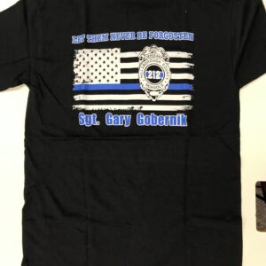 A black shirt with an american flag and police badge.