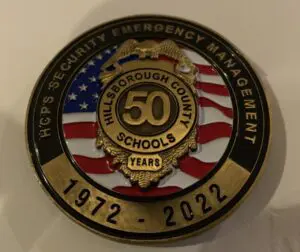 50 years hcps security em badge